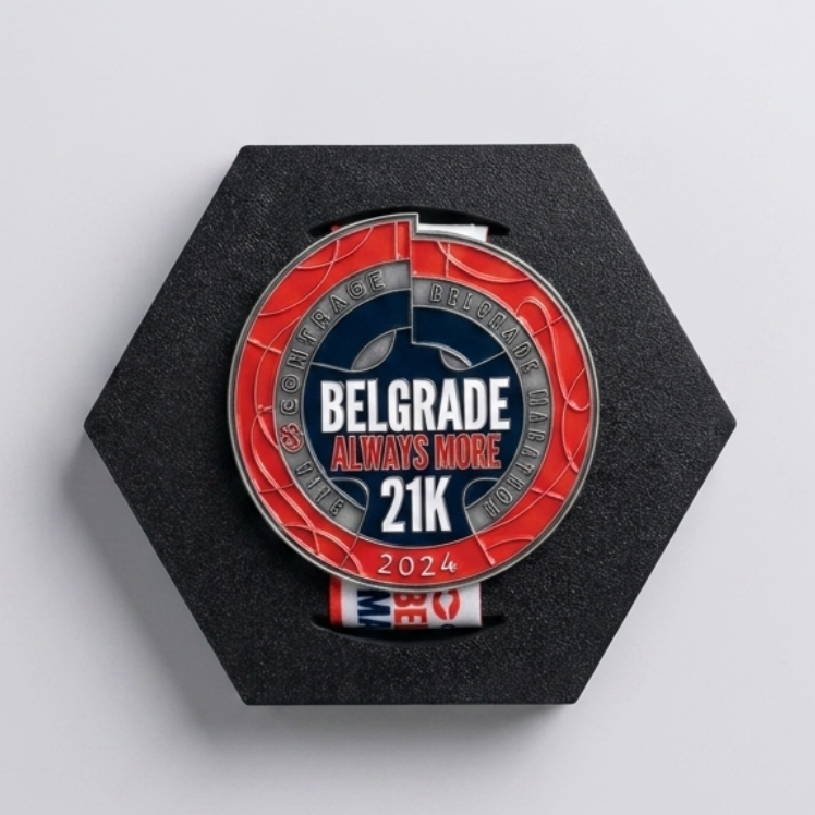 A circular 21K running medal with a red, black, and white design, mounted on a black hexagonal display stand against a light gray background.